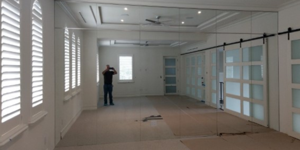 Mirrored walls with hidden door for dance studio, salon Orlando